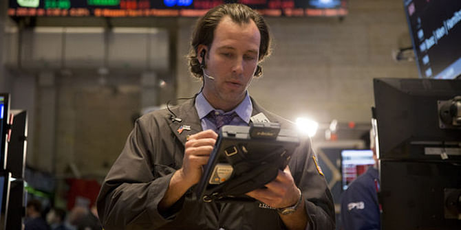 A trader works on the floor of the New York Stock Exchange (NYSE) in New York. Photo: Bloomberg