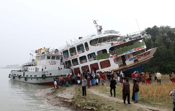 NO, IT'S NOT A TSUNAMI: This launch, MV Dwipraj, ploughed into a paddy field on the bank of the Kirtankhola River along with around 1000 passengers on board on Friday night due to dense fog. Although there was no casualty, the fuel oil of the vessel continued to spill into the river from the engine room. PHOTO: STAR