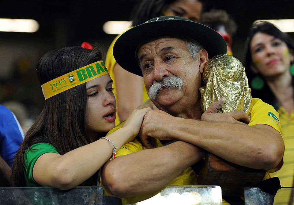 Brazil fans look dejected following the 2014 FIFA World Cup Brazil Semi Final match between Brazil and Germany at Estadio Mineirao on July 08, 2014 in Belo Horizonte, Brazil. Photo: Getty Images