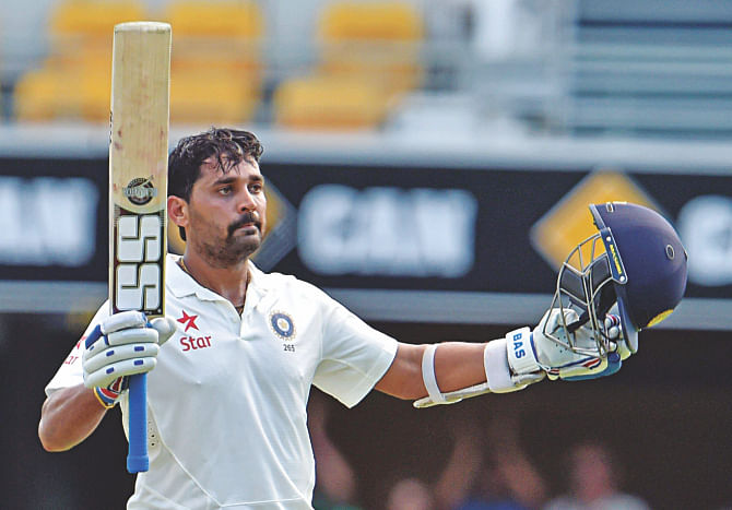 India batsman Murali Vijay celebrates his century during the first day of the second Test against Australia at the Gabba in Brisbane on Wednesday. PHOTO: AFP