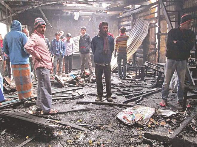 POLITICS OF VENGEANCE: The ruins of the Awami League office, on the main road in Pirojpur district town yesterday. The activists of the opposing parties allegedly set fire to each other's office. Photo: Focus Bangla