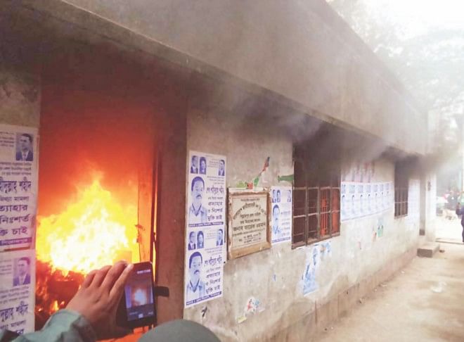 POLITICS OF VENGEANCE: The burning BNP office, on Post Office Road, in Pirojpur district town yesterday. The activists of the opposing parties allegedly set fire to each other's office. Photo: Star