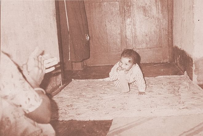 This old photo from the family album shows mother Laily clapping so that her infant son Rajib smiles for the camera. A year and a half later, Rajib died after he was given toxic paracetamol syrup. Photo: Courtesy of Laily Begum
