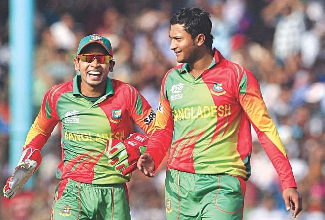 HAPPY DAYS: Bangladesh skipper Mushfiqur Rahim (L) and ace all-rounder Shakib Al Hasan share a light moment on the field during the ICC World Twenty20 warm-up game against Ireland in Fatullah yesterday. After much heartbreak over the last two months, the two key players put in stellar turns with the bat to complete a clinical victory. PHOTO: Firoz Ahmed