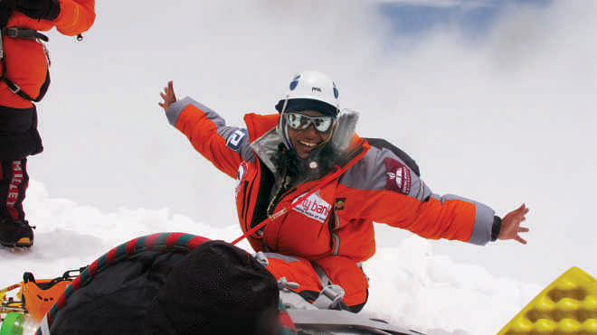 Happy Wasfia resting  in Camp 3 post-summit,  Everest.  Photo: Nurbu Sherpa