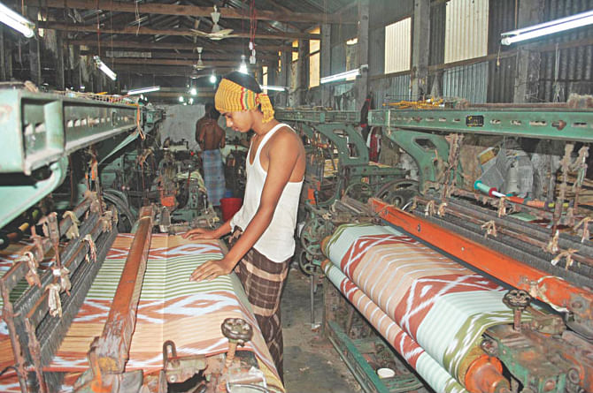 Loom workers busy at work filling their orders ahead of Eid-ul-Fitr this year. Photo: Star