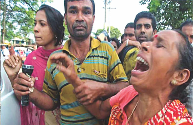 A relative in tears at Barobazar level crossing in Jhenidah after a train rammed a bus killing 11 people early yesterday.  Photo: Star