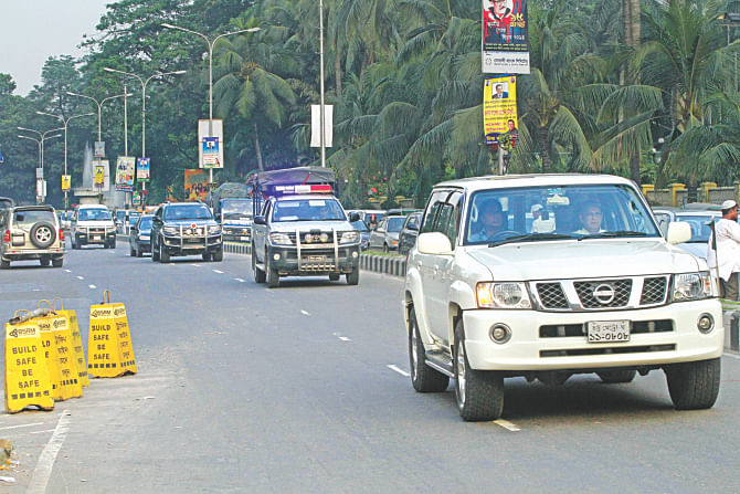 Rules are for others: Huge sport utility vehicles of ministers and VIPs take to the wrong side of the street in front of Ruposhi Bangla hotel to dodge the long queue stuck at the set of lights. Photo: Amran Hossain/Sk Enamul Haq/Rashed Shumon
