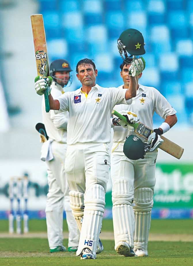 Younis Khan of Pakistan celebrates his 25th Test hundred on the opening day of the first Test against Australia in Dubai yesterday. PHOTO: CRICINFO