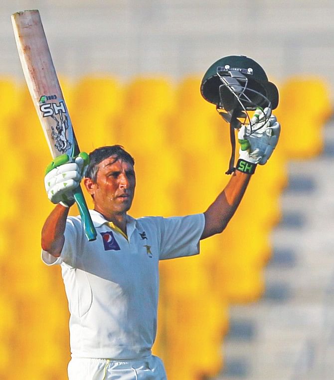 Younis Khan of Pakistan celebrates his third consecutive Test century against Australia on the first day of the second Test in Dubai yesterday. PHOTO: AFP