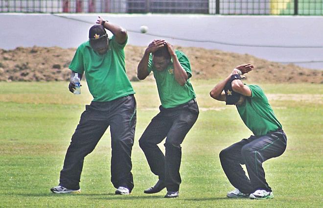 WATCH OUT! Three Zimbabwe players duck to avoid being hit by a ball at the MA Aziz Stadium in Chittagong yesterday. Photo: Anurup Kanti Das