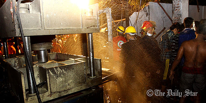 Firefighters try to douse the fire at plastic factory in Mirpur-1 Saturday evening. Photo: Palash Khan