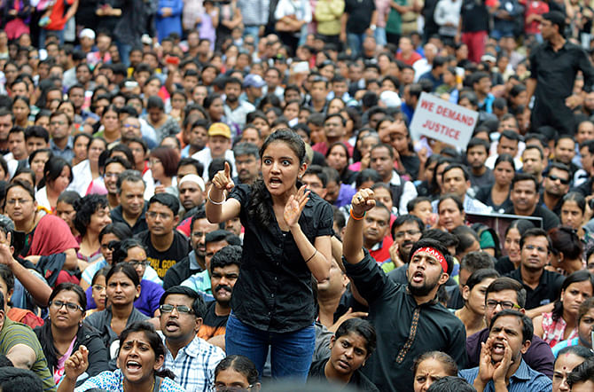 This Reuters photo taken on July 19, 2014 shows a demonstrator shouting slogans during a protest in the southern Indian city of Bangalore. Hundreds of demonstrators on that day held a protest rally demanding justice after a 6-year-old student was allegedly raped by two staff members within a school's premises in the city on July 2. 