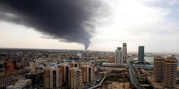 Smoke fills the sky over Tripoli after rockets are fired by one of Libya's militias. Photo taken from Amnesty international