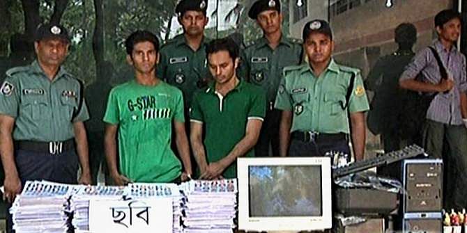 Law enforcers produce two men with fake national identity (NID) cards before the reporters at Dhaka Metropolitan Police media centre in Minto Road of the capital on Saturday. Photo: TV grab