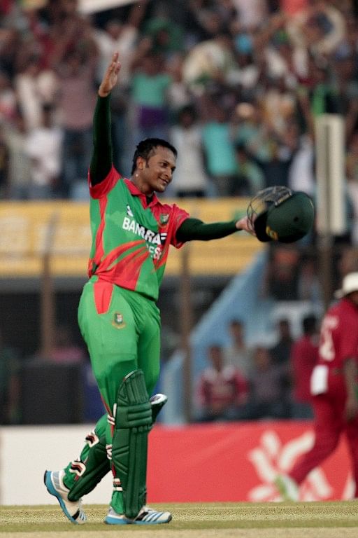 Bangladesh cricketer Shakib Al Hasan reacts after scoring a century (100 runs) during the first one day international (ODI) match between Bangladesh and Zimbabwe at The Zahur Ahmed Chowdhury Stadium in Chittagong on November 21, 2014. Photo: AFP
