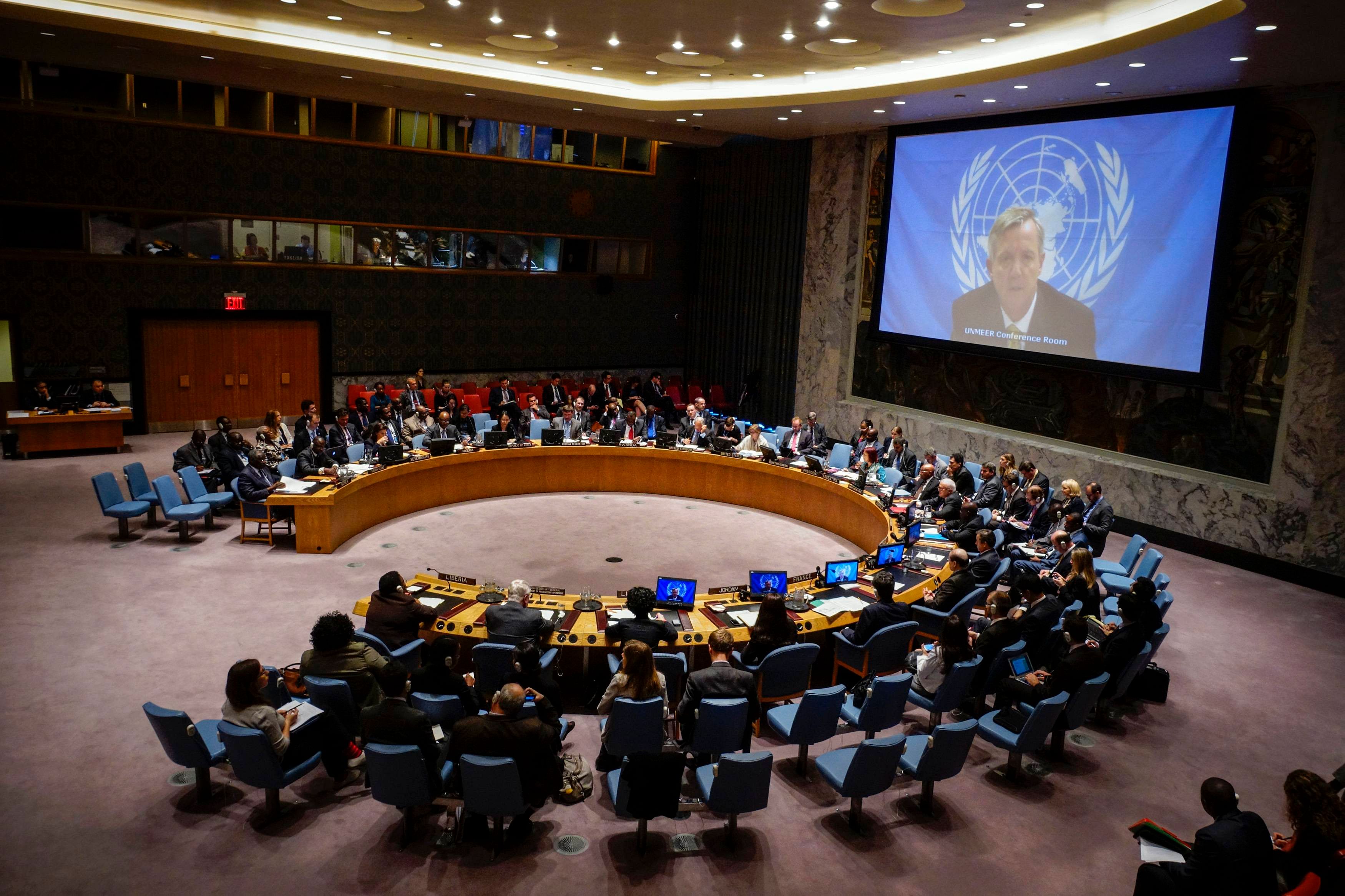 UN Ebola mission chief Anthony Banbury (on Screen) speaks to members of the United Nations Security Council during a meeting on the Ebola crisis at the UN headquarters in New York , October 14, 2014. 