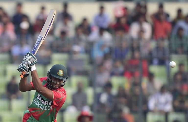 Bangladesh cricketer Shakib Al Hasan plays a shot during the fifth and the final one-day international (ODI) match between Bangladesh and Zimbabwe at the Sher-e Bangla National Stadium in Dhaka on December 1, 2014. Photo: AFP/ Munir uz ZAMAN
