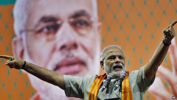 Narendra Modi at an election rally Narendra Modi has denied any responsibility for the Gujarat riots, in which many Muslims were killed. Photo: AP