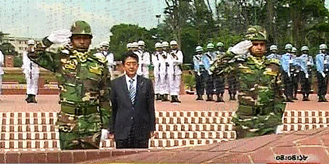 Japanese PM pays tributes to the martyrs of 1971 Liberation War by placing wreaths at the National Mausoleum in Savar on Saturday.  Photo: TV grab