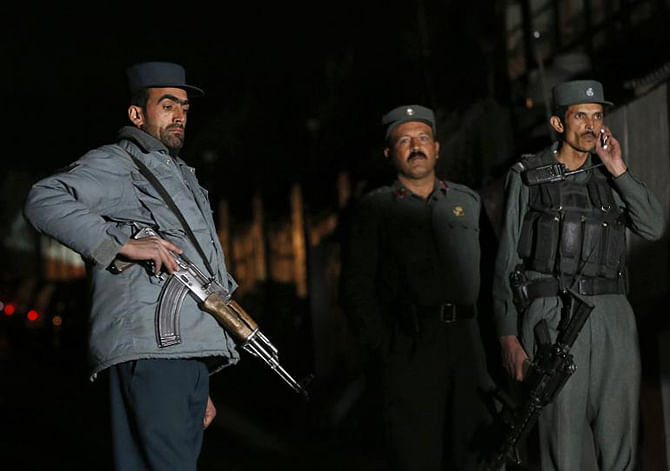  Afghan police at the site of an incident in Kabul November 27, 2014. An attack Wednesday on a wedding in Helmand province came on the final day of US combat presence in Afghanistan. Photo: Reuters