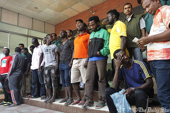 Detectives detain the 31 foreign nationals including 21 Nigerians from different parts of Dhaka. Photo: Rashed Suman
