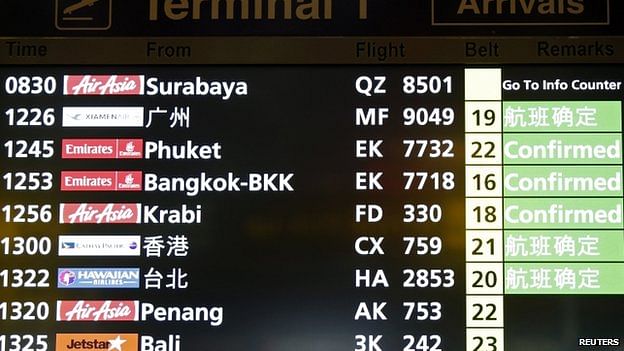 A flight arrival information signboard shows the status of AirAsia flight QZ 8501 from Indonesian city of Surabaya to Singapore at Changi Airport in Singapore December 28, 2014. Photo: Reuters