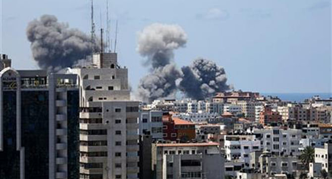 Smoke rises after an Israeli missile strike in Gaza City, Friday. Photo: AP