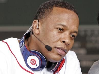 Recording artist Dr. Dre wears a pair of Beats headphones as he attends the MLB 2010 season opener between the New York Yankees and Boston Red Sox at Fenway Park in Boston, in this file photo taken April 4, 2010. Photo: Reuters
