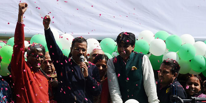 Indian Aam Aadmi Party (AAP) leader Arvind Kejriwal gestures as he speaks to supporters following his victory in the state assembly elections outside the party's headquarters in New Delhi on February 10, 2015. Photo: AFP