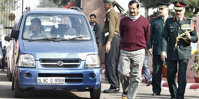 Arvind Kejriwal (3rd R), head of Aam Aadmi (Common Man) Party (AAP) and chief minister of Delhi, walks past his car as he arrives at the National Cadet Corps (NCC) camp in New Delhi yesterday. The government in the Indian capital, Delhi, has launched a helpline to assist people deal with demands for bribes by government workers.