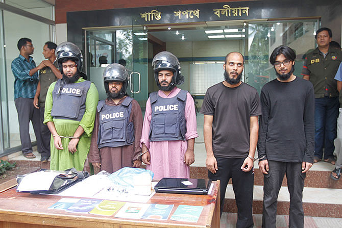 This STAR photo taken on September 25 shows five suspected militants, including Asif Adnan Shuvo, at a press conference, a day after detectives detained them in the capital. 