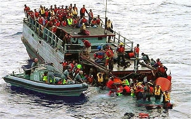 In 2001 Australian navy personnel rescued asylum-seekers from a sinking boat off Christmas Island Photo: Reuters 