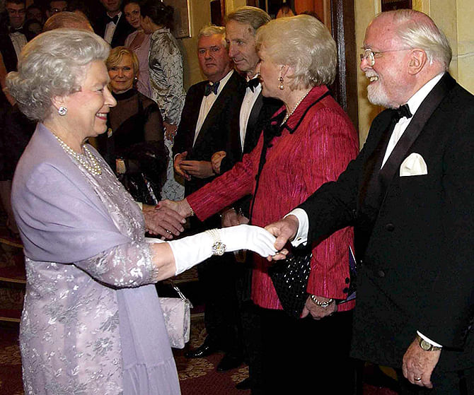 Britain's Queen Elizabeth meets Sir Richard Attenborough and his wife at a gala performance of 