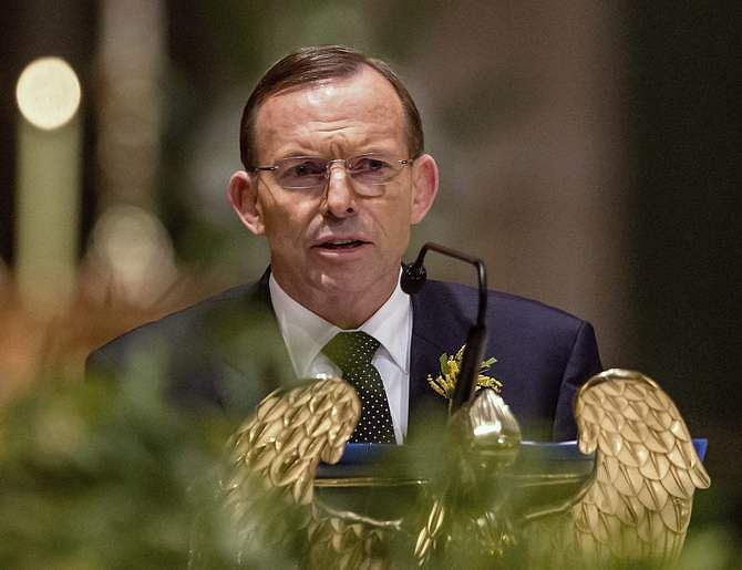 Australian Prime Minister Tony Abbott delivers remarks at a national memorial service for the victims of Malaysia Airlines flight MH17 at St Patrick's Cathedral in Melbourne August 7, 2014. Photo: Reuters