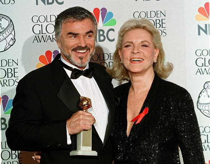 3.	Actors Burt Reynolds and Lauren Bacall pose for photographers as Reynolds holds his Golden Globe that he won for best supporting actor in a motion picture for the film "Boogie Nights", at the 55th annual Golden Globe Awards in Beverly Hills, in this file picture taken January 18, 1999. Photo: Reuters