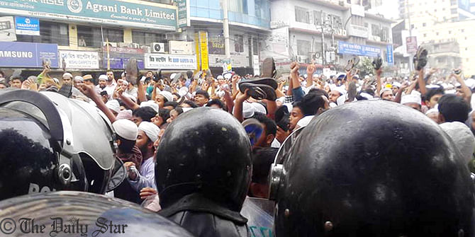Muslim devotees bring out the procession from Baitul Mukarram National Mosque to Dainik Bangla intersection in Dhaka on Friday demanding capital punishment of Latif Siddique. Photo: Prabir Barua 