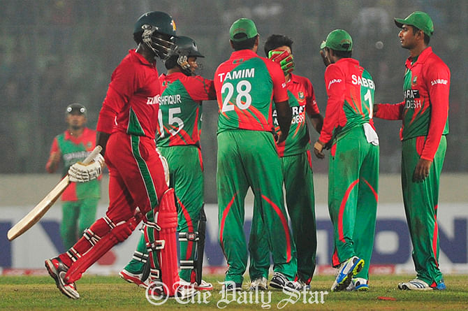 Tigers celebrate a wicket of Zimbabwe in the fourth ODI at Mirpur Friday. Photo: Firoz Ahmed