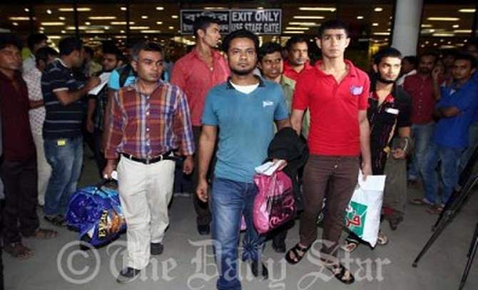 In this August 4, 2013 photo, 17 Bangladeshi workers arrive at Shahjalal International Airport after languishing in an Egyptian jail for their illegal entry into the country.