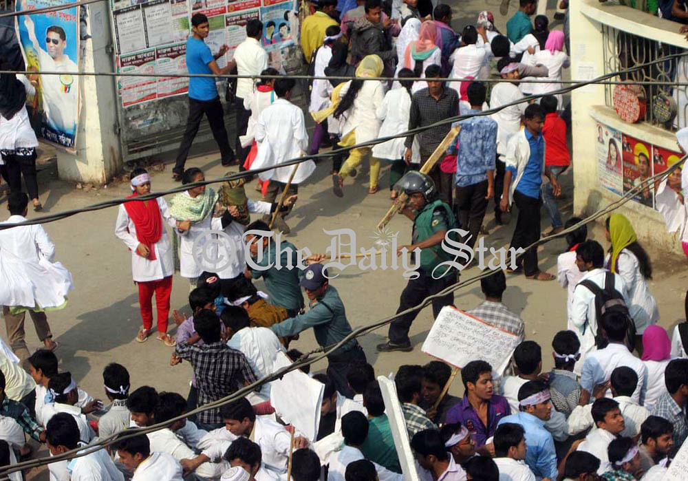 Police charge batons on agitating students of Barisal Health Technology Institute during their agitation in the city on Wednesday. Photo: STAR