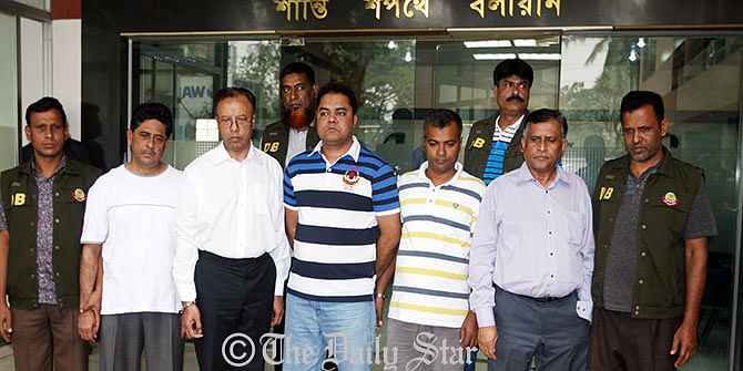Detectives produce five persons, who are arrested on charge of gold smuggling, at media centre of Dhaka Metropolitan Police in Dhaka Wednesday. Three of them are high officials of Biman Bangladesh Airlines. Photo: Palash Khan
