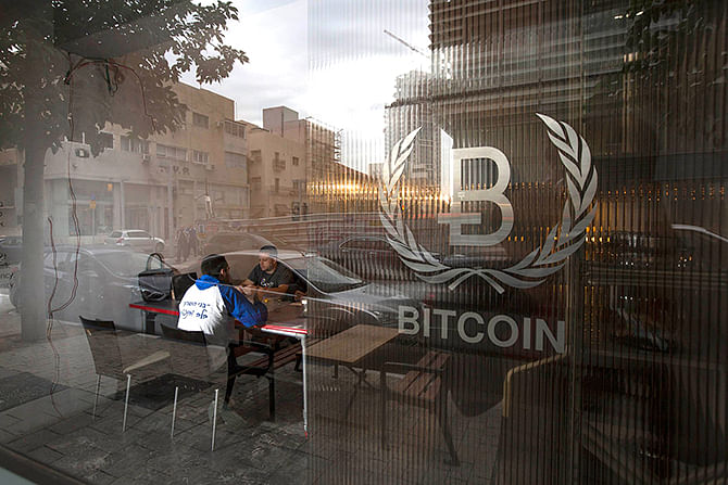 This Reuters photo taken on February 2 shows people sitting inside the Bitcoin Embassy in Tel Aviv. In the first confirmation of a criminal investigation at Mt. Gox, the failed Tokyo-based bitcoin exchange said on march 26 it was working with the police "with regard to the disappearance" of bitcoins worth some $490 million at current prices. Mt. Gox filed for bankruptcy protection in Tokyo on February 28, saying 750,000 bitcoins belonging to its customers and 100,000 of its own bitcoins were stolen by hackers who exploited a security flaw in its software. It also said $28 million were "missing" from its Japanese bank accounts. 