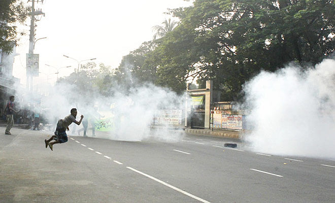 A pro-hartal picketer jumps in the air as he blasted a cocktail on the Shahjahanpur intersection in Dhaka last year. Star file photo