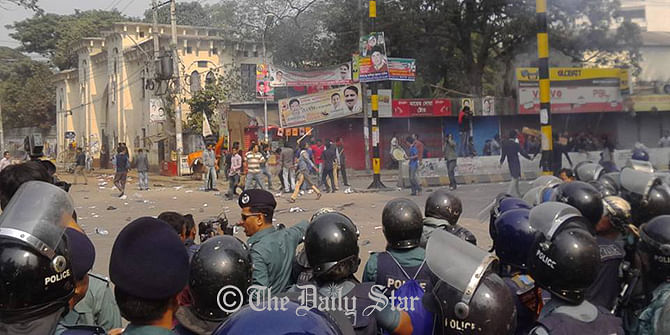 BNP supporters lock into a clash at Bakshibazar in Dhaka before their party Chairperson Khaleda Zia appears in a courtroom there on Wednesday. Photo: Prabir Barua Chowdhury