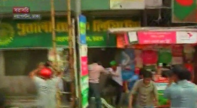 An activist of Jatiyatabadi Chhatra Dal, student wing of BNP, beat up another rival activist in front of the party’s Nayapaltan office in Dhaka Sunday afternoon. Photo TV grab