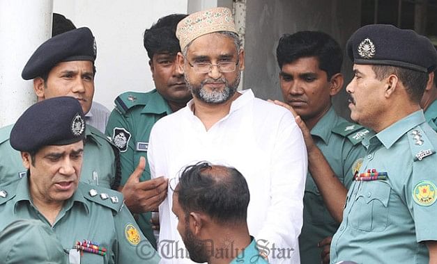 The Star file photo shows law enforcers bring out former BNP lawmaker Nasiruddin Ahmed Pintu from a court in Dhaka.