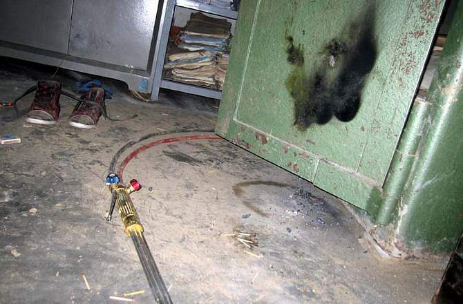 A tool is seen lying on the floor of the vault, which was used by robbers for cutting lockers at Adamdighi branch of Sonali Bank in Bogra Saturday. The robbers took away around Tk 30.8 lakh from the bank digging a tunnel. Photo: STAR