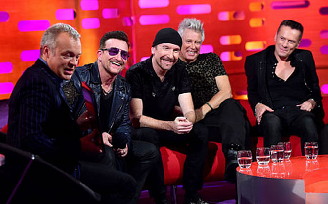 Caption: (left to right) Graham Norton, Bono, The Edge, Adam Clayton and Larry Mullen Jr during filming of the Graham Norton show (BBC). Photo: BBC