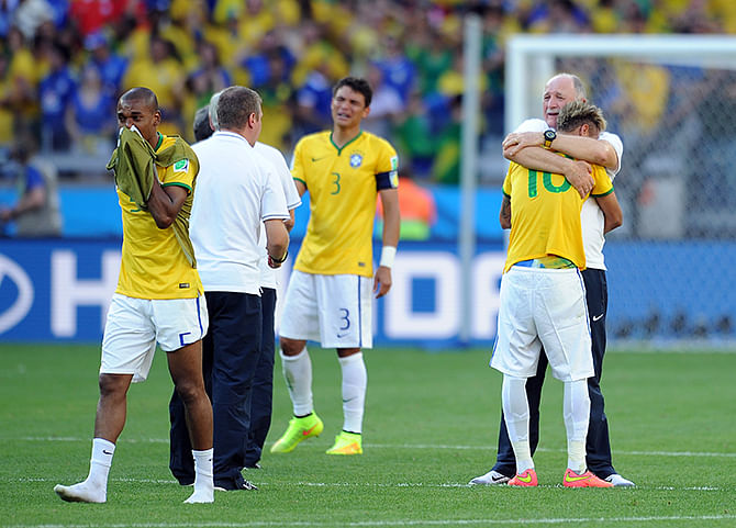 Neymar of Brazil is embraced by manager Luis Felipe Scolari following the 2014 FIFA World Cup Brazil Round of 16 match between Brazil and Chile at Estadio Mineirao on June 28, 2014 in Belo Horizonte, Brazil. Photo: Getty Images