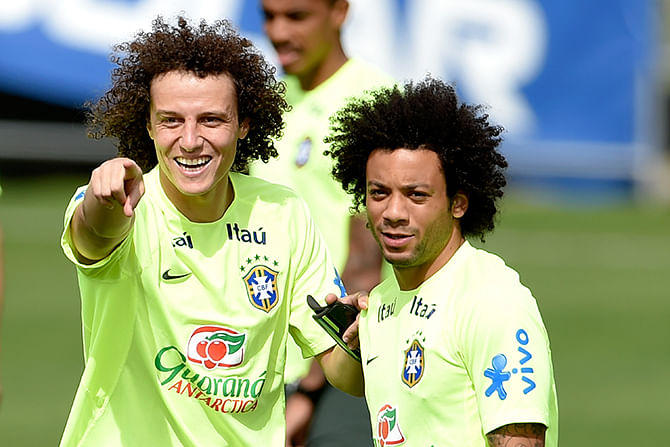 David Luiz gestures with Marcelo (R) during a training session of the Brazilian national football team at the squad's Granja Comary training complex, on July 07, 2014 in Teresopolis, 90 km from downtown Rio de Janeiro, Brazil. Photo: Getty Images